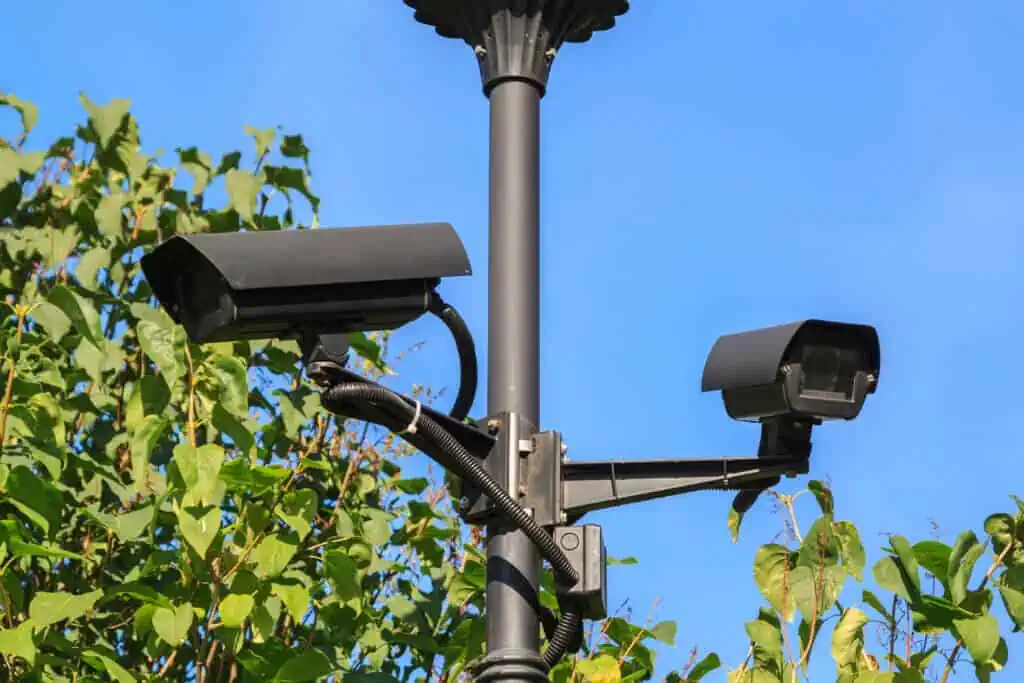 outdoor video surveillance cameras installed in several directions for easy monitoring of the order in the modern city Park